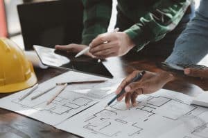 the,home,design,architects,are,reviewing,the,house,plan,draft,