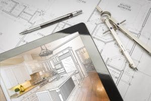 computer,tablet,showing,kitchen,illustration,sitting,on,house,plans,with