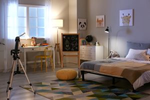 interior,of,child's,room,with,telescope,in,evening