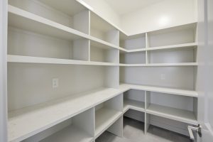 very,clean,and,empty,pantry,with,white,shelves.,the,pantry